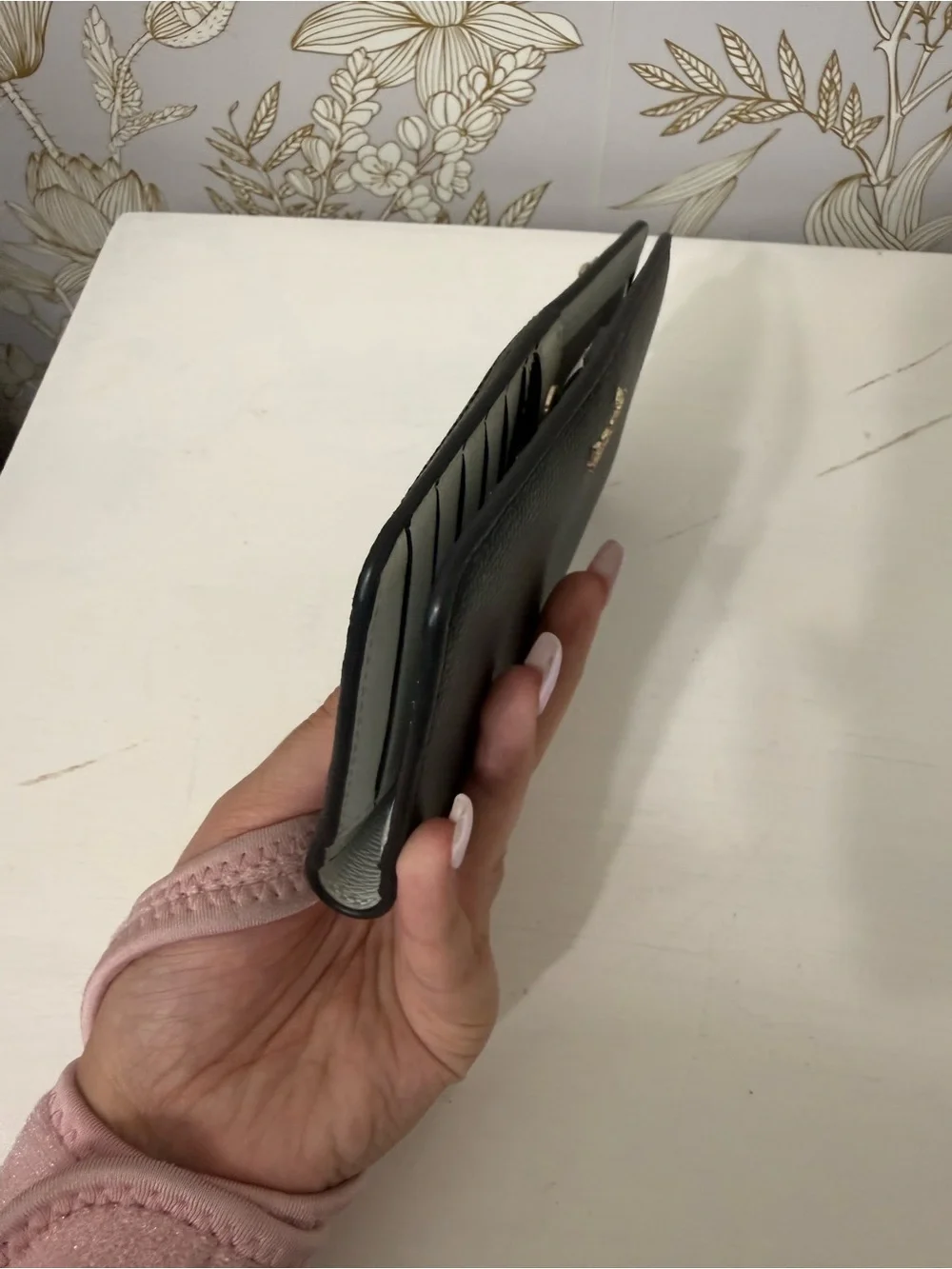 kate spade black leather zip-around continental wallet with gold logo